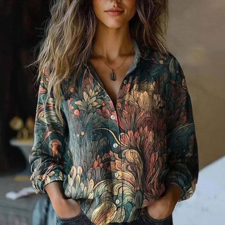 Women's floral collared button-down shirt with long sleeves and chest pockets