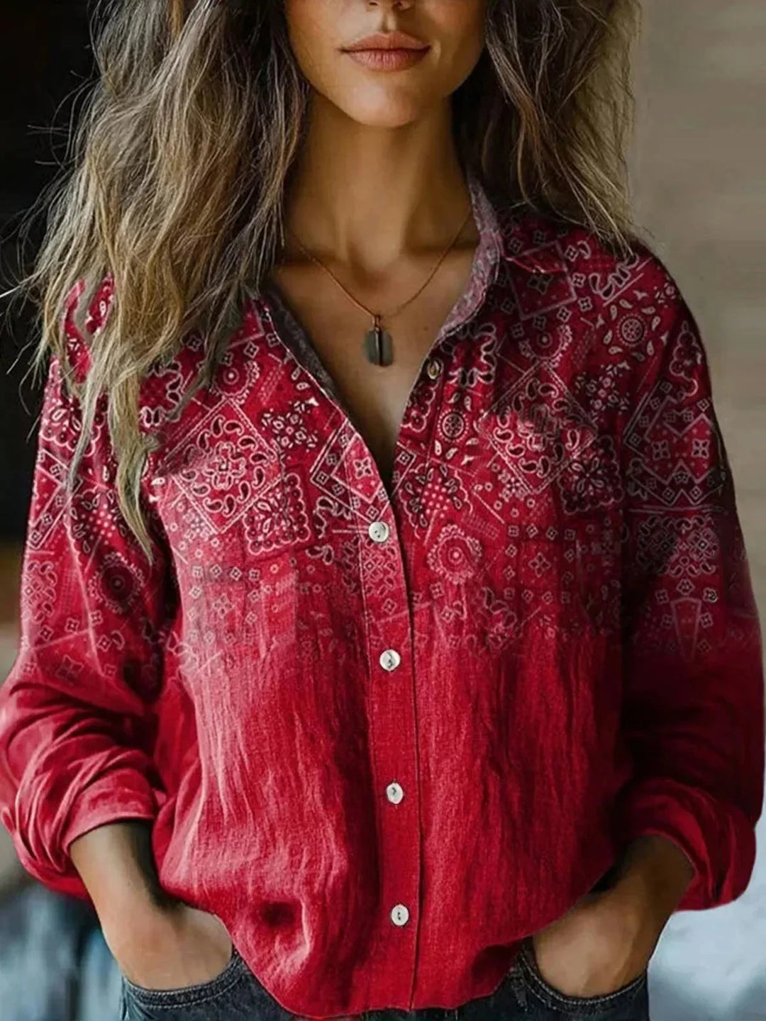 Women's floral collared button-down shirt with long sleeves and chest pockets