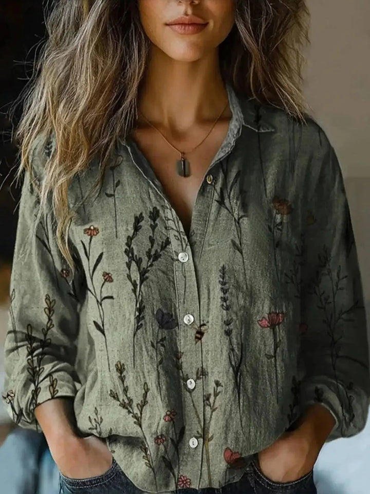 Women's floral collared button-down shirt with long sleeves and chest pockets