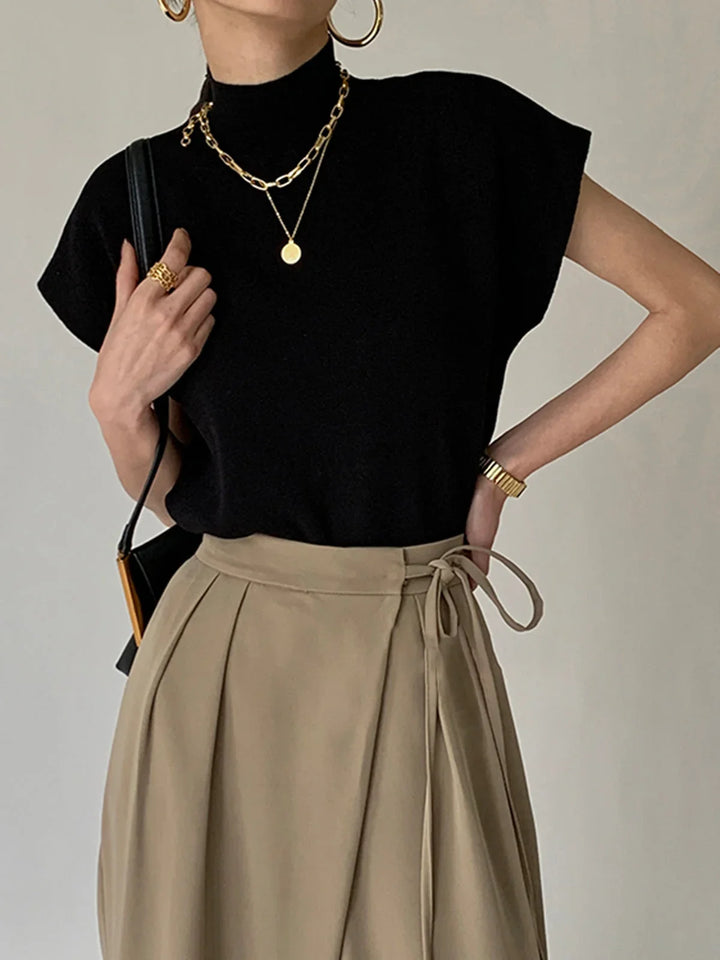 Women's knit padded-shoulder top with mock-neck and cap-sleeves