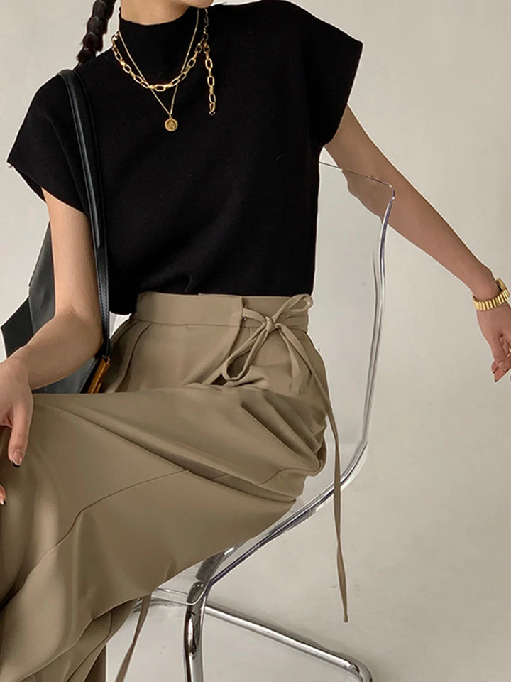 Women's knit padded-shoulder top with mock-neck and cap-sleeves