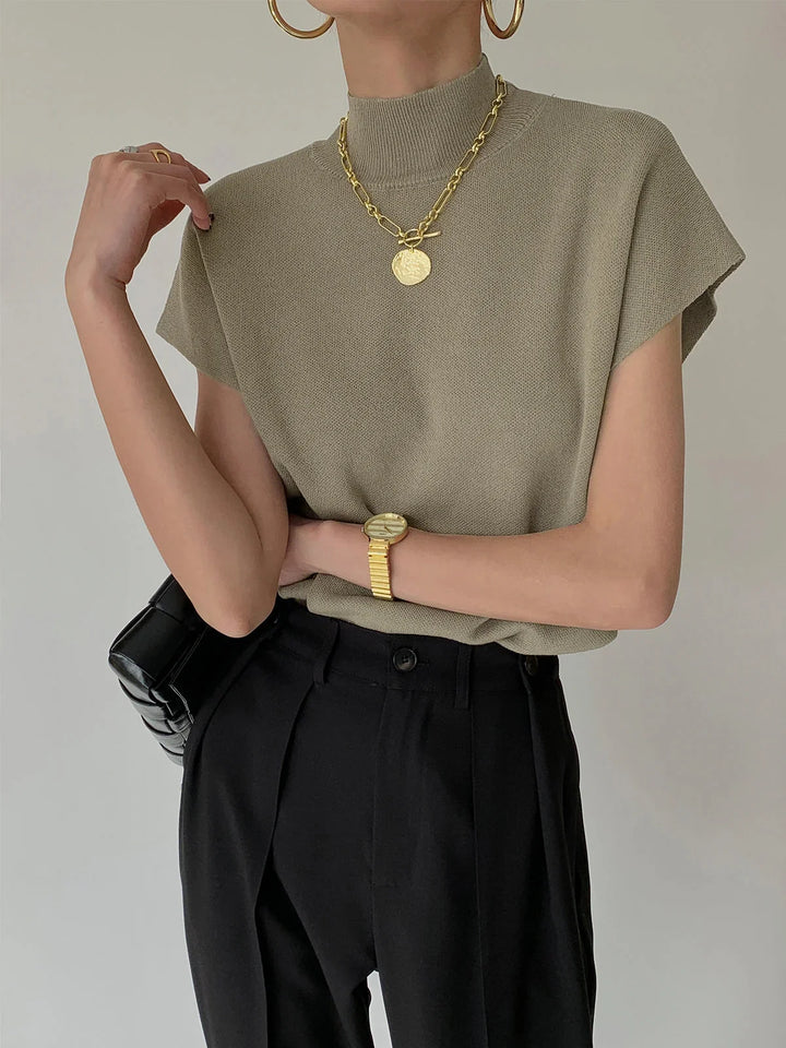Women's knit padded-shoulder top with mock-neck and cap-sleeves