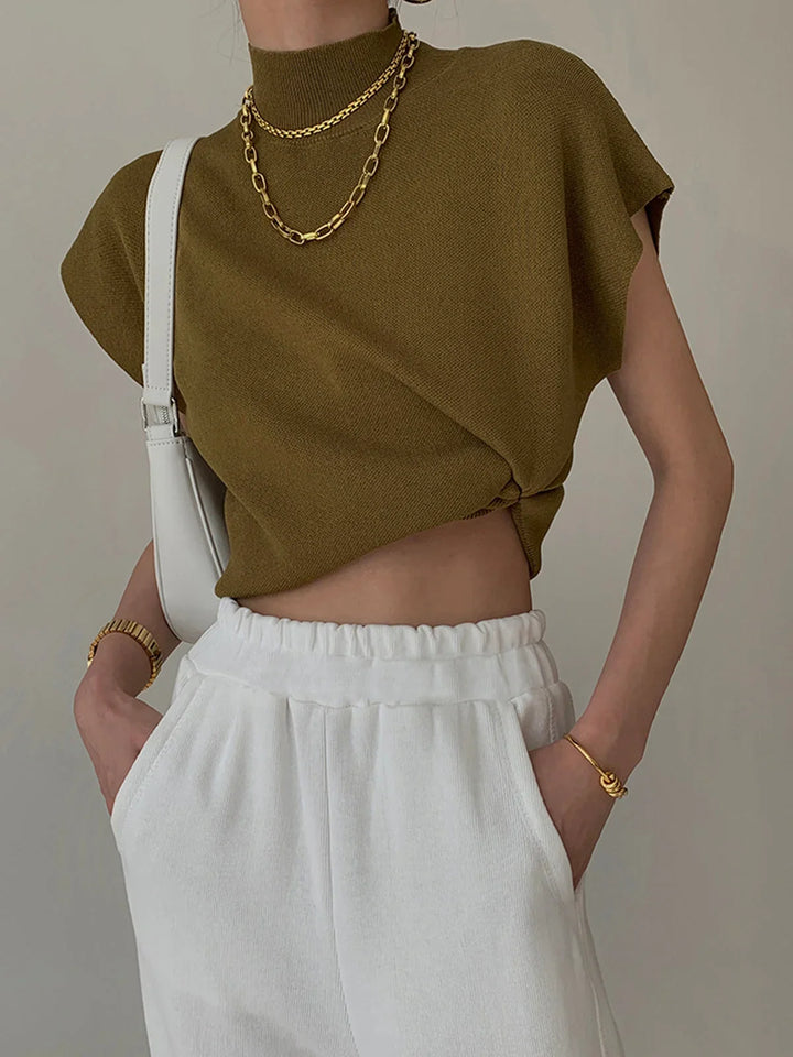 Women's knit padded-shoulder top with mock-neck and cap-sleeves