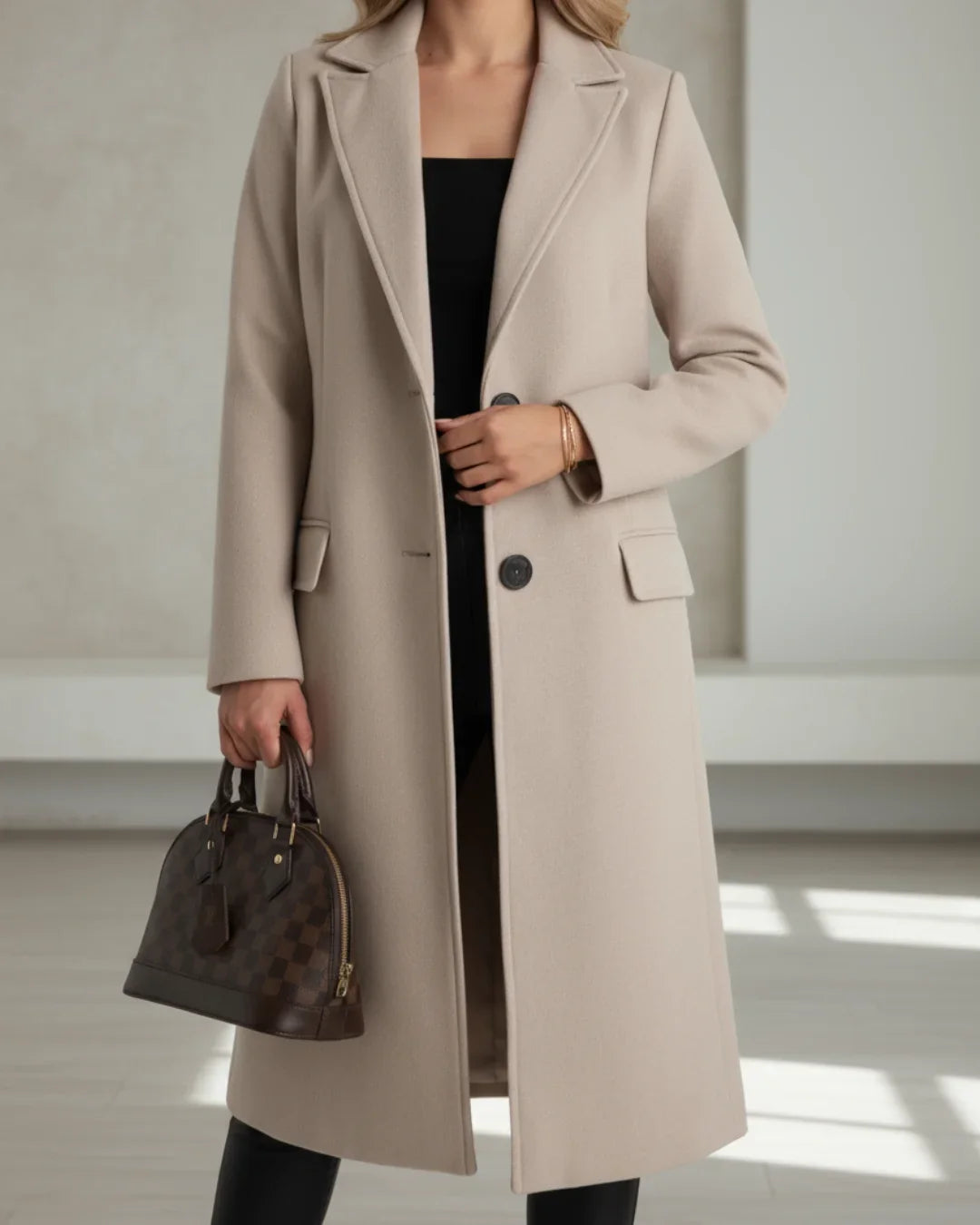 Women's long tailored wool coat with notched lapel and single-breasted front
