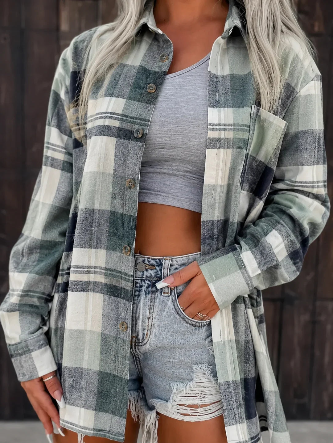 Women's oversized plaid flannel long-sleeve button-down shirt with chest pockets