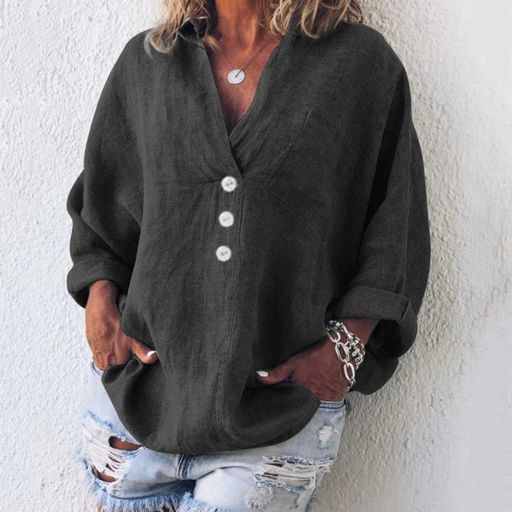 Women's oversized V-neck top with button-front long sleeves and chest pocket