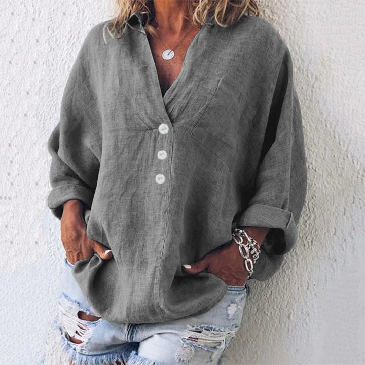 Women's oversized V-neck top with button-front long sleeves and chest pocket