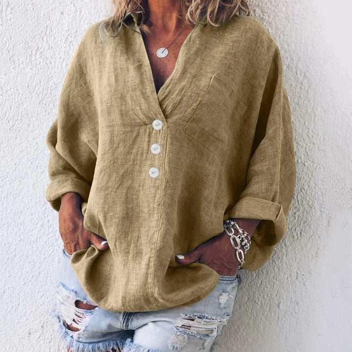 Women's oversized V-neck top with button-front long sleeves and chest pocket