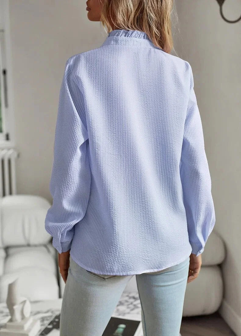 Women's pale blue textured striped blouse with long sleeves and ruffled stand-collar