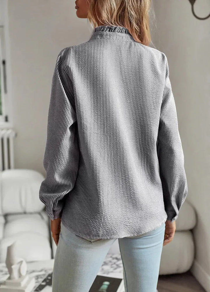 Women's pale blue textured striped blouse with long sleeves and ruffled stand-collar