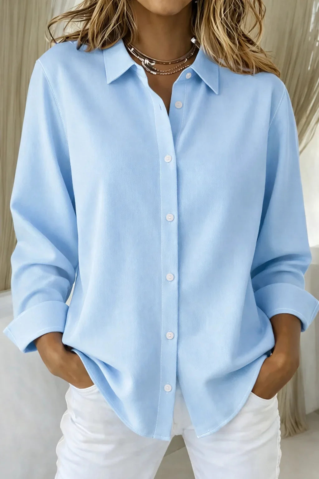 Women's pink long-sleeve collared blouse with button-front and contrast stitching