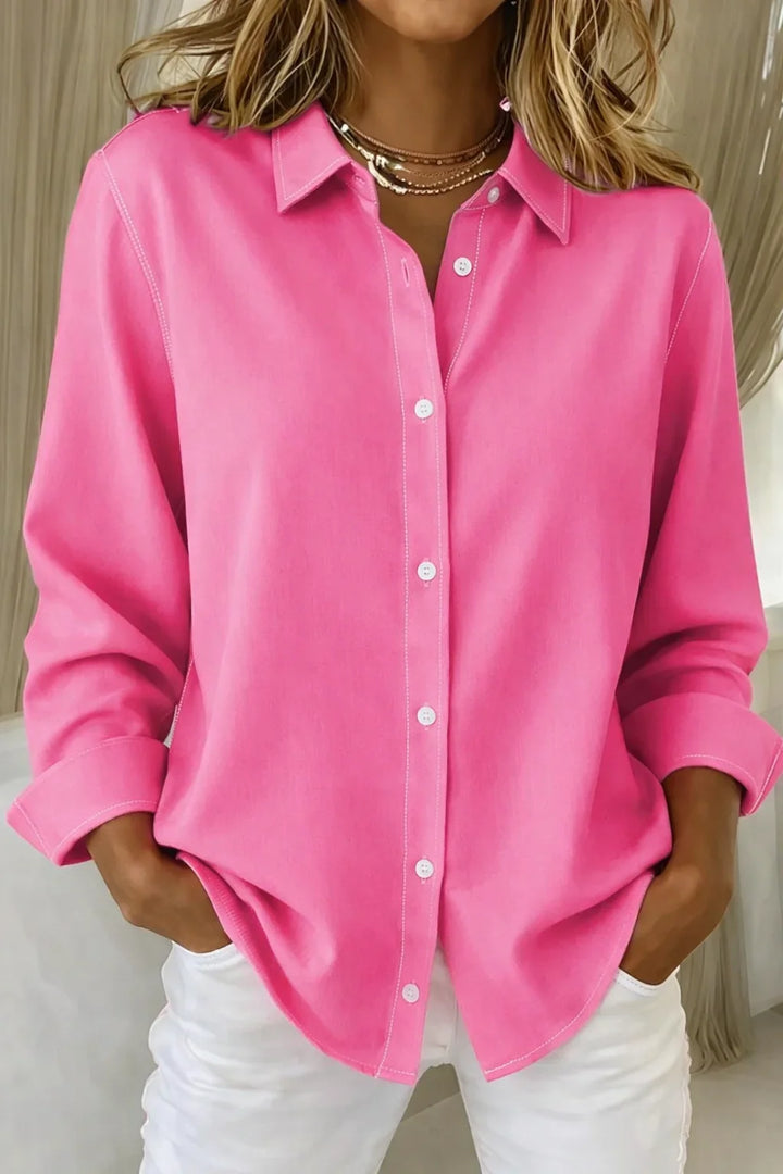 Women's pink long-sleeve collared blouse with button-front and contrast stitching