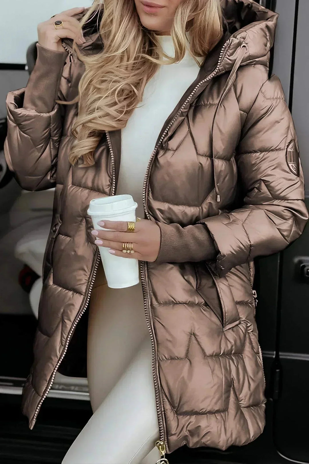 Women's quilted metallic hooded puffer jacket with full zip closure